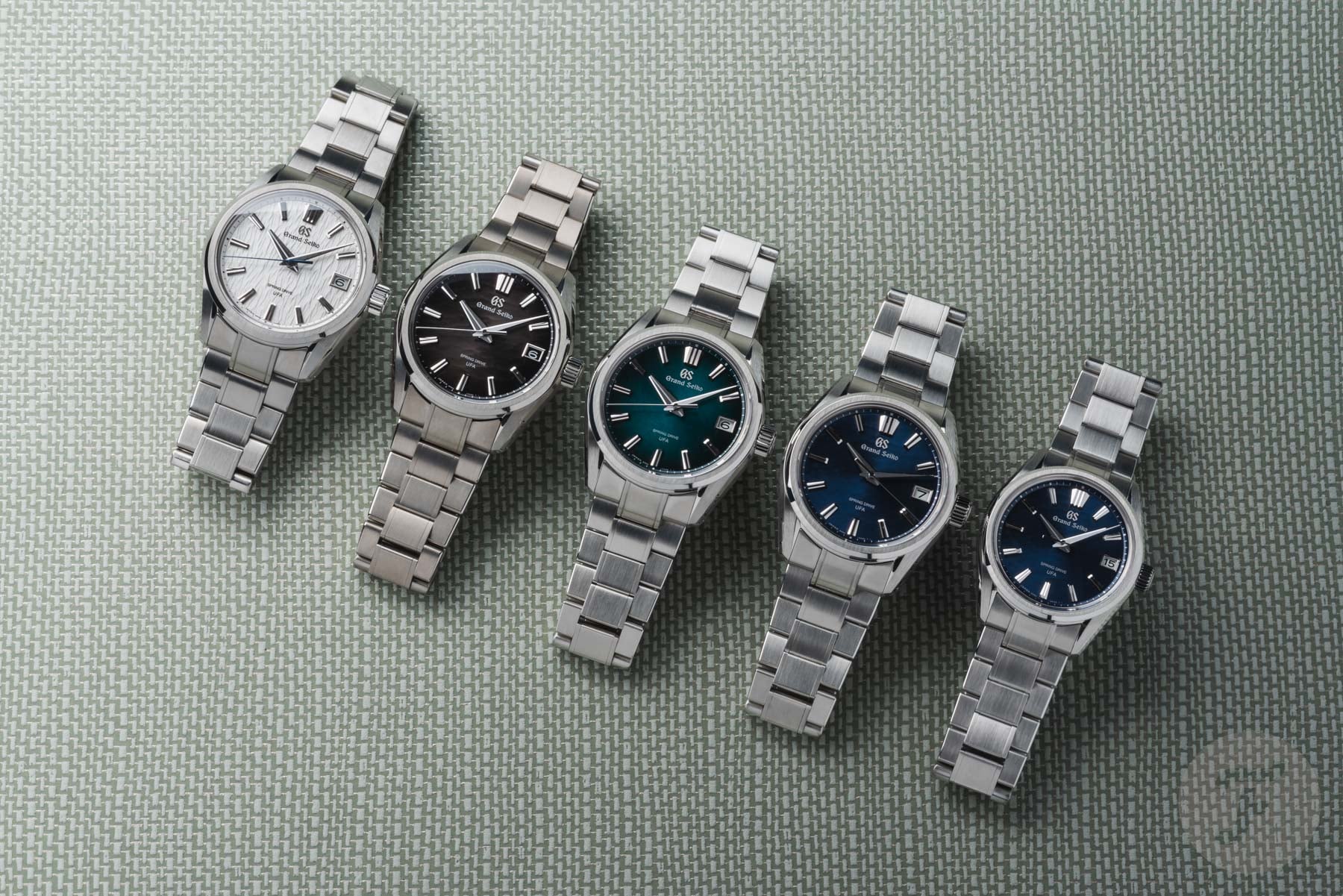 Grand Seiko Evolution 9 Collection Spring Drive U.F.A. SLGB011, SLGB007, SLGB009, SLGB013, and SLGB015 group shot, flat-lay