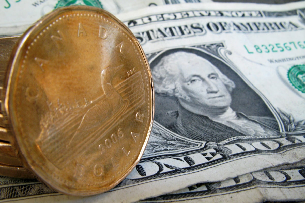 ‘A bruising to an already beaten currency’: Loonie slides to 14-month low, nears break below 70 cents US