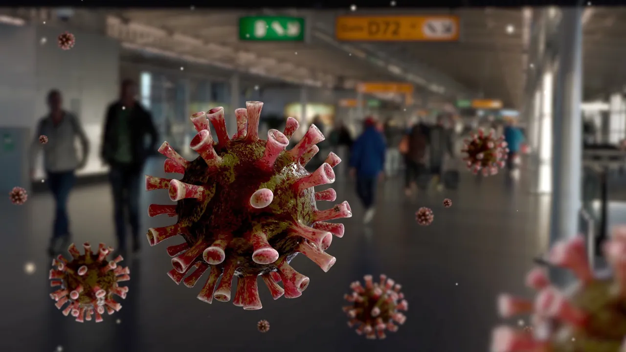 Measles virus particles appear over a crowded airport terminal