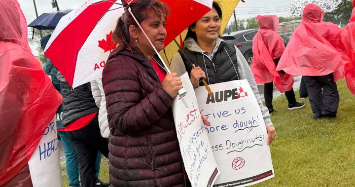 Alberta health-care workers rally in Calgary for better job conditions