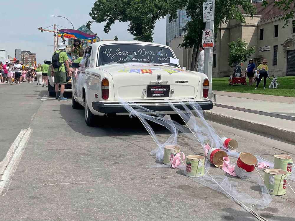 MAGGIE MACINTOSH / FREE PRESS
Academy Hospitality decked out a vintage car for its Pride float to celebrate the marriage of Mira Kopiova and Jamie Komarniski who were grand marshals for the parade.
