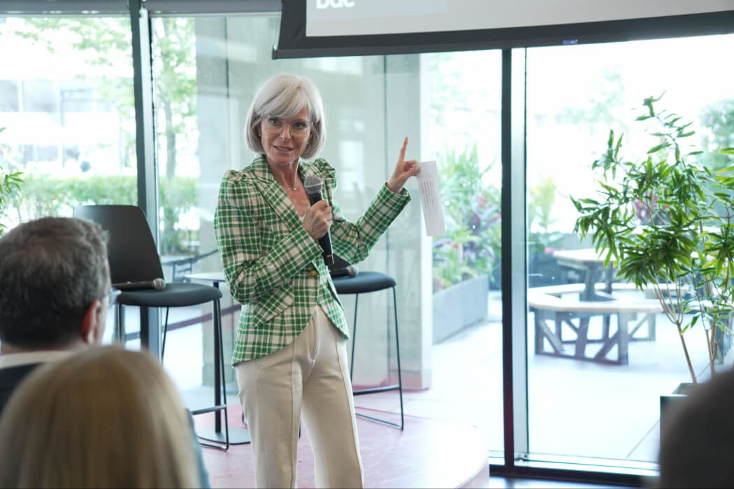 Isabelle Hudon speaks in front of a small crowd