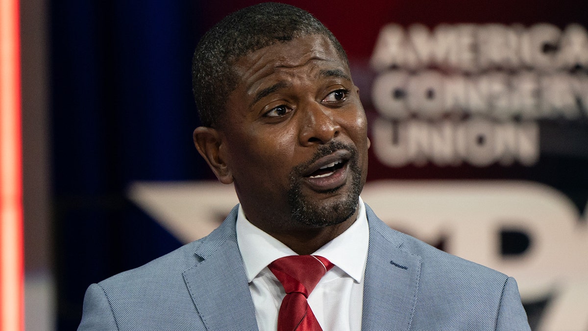 Jack Brewer speaking during a panel discussion at CPAC in Orlando, Florida.