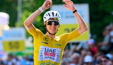 Tadej Pogacar celebrates as he crosses the finish line to win the fifth and final stage of the Tour de Suisse