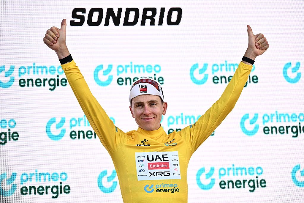 Slovenia's rider Tadej Pogacar of team UAE Emirates - XRG celebrates on the podium of the first stage of the Men's Tour of Switzerland (Tour de Suisse) cycling race, in Sondrio, Italy, on June 17, 2026. (Photo by Marco BERTORELLO / AFP)