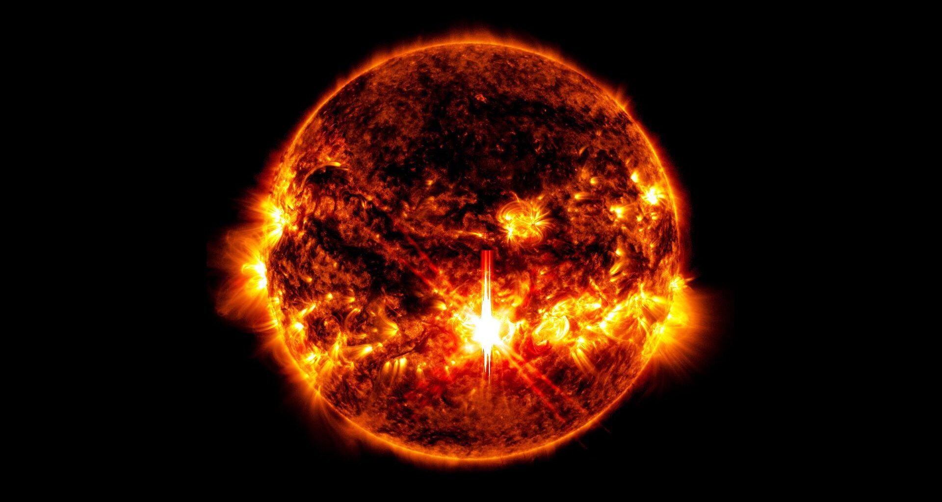 An image of a very violent looking sun against the darkness of space. In the center slightly toward the bottom there is a very bright spot.