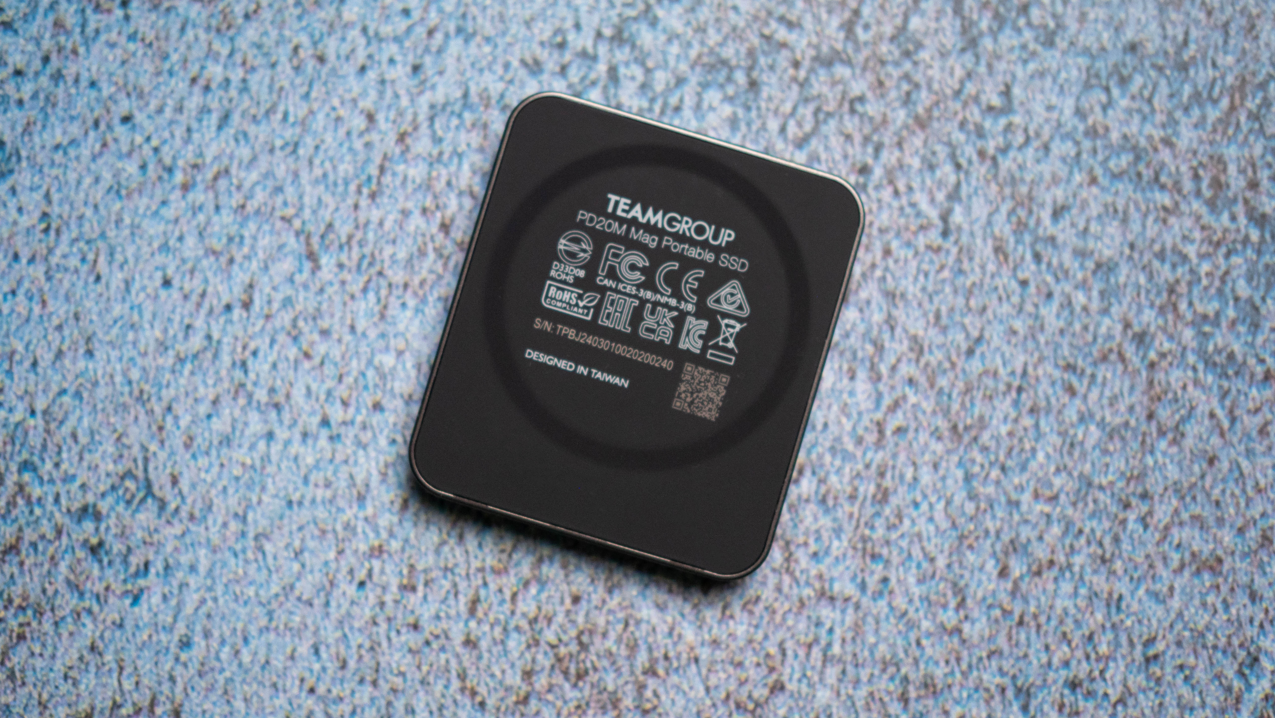 TeamGroup PD20M MagSafe SSD design photos against a craft sheet