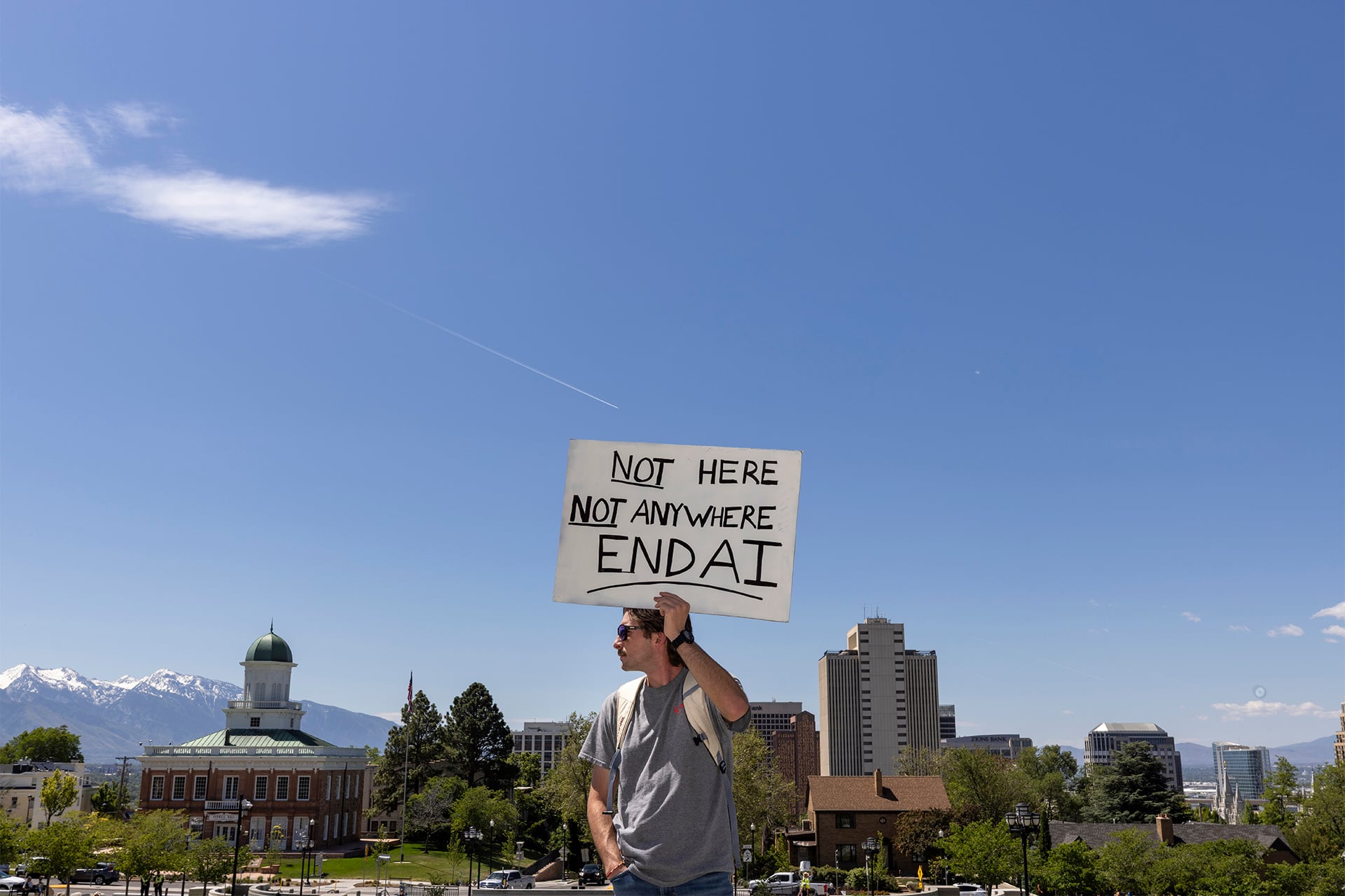 Scott Kwiatkowski from takes part in a demonstration at the Utah State Capitol to oppose the construction of the Stratos data center in Box Elder County on May 23, 2026 in Salt Lake City, Utah. The proposed data center, that will be about 40,000 acres and is speculated to use 9 gigawatts of power, is facing heavy backlash. 
