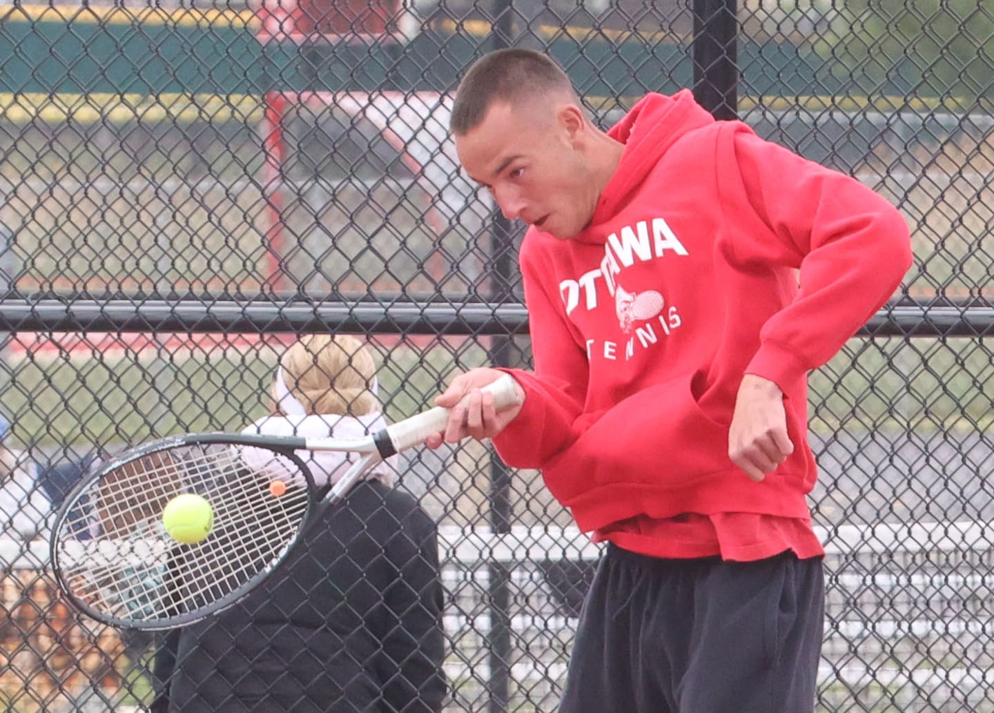 Ottawa's Kaden Araujo returns a serve during the Class 1A Sectional tennis meet this past season at the La Salle-Peru Township High School Athletic Complex in La Salle.