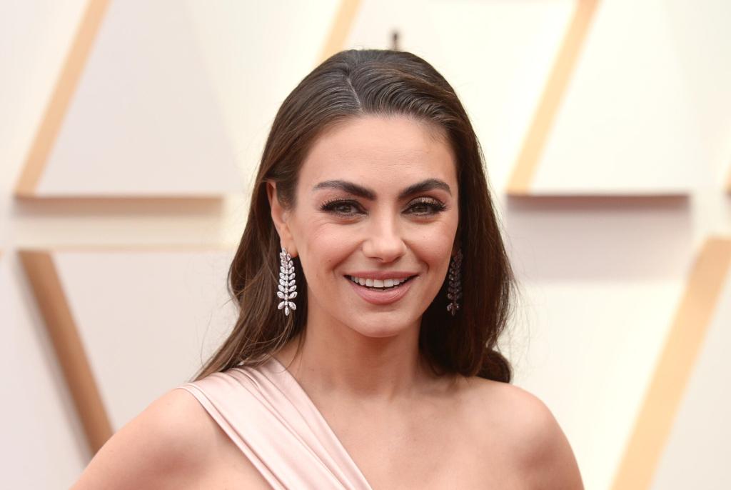 Mila Kunis’ Swimsuit Video Shows Controversial Friend Group