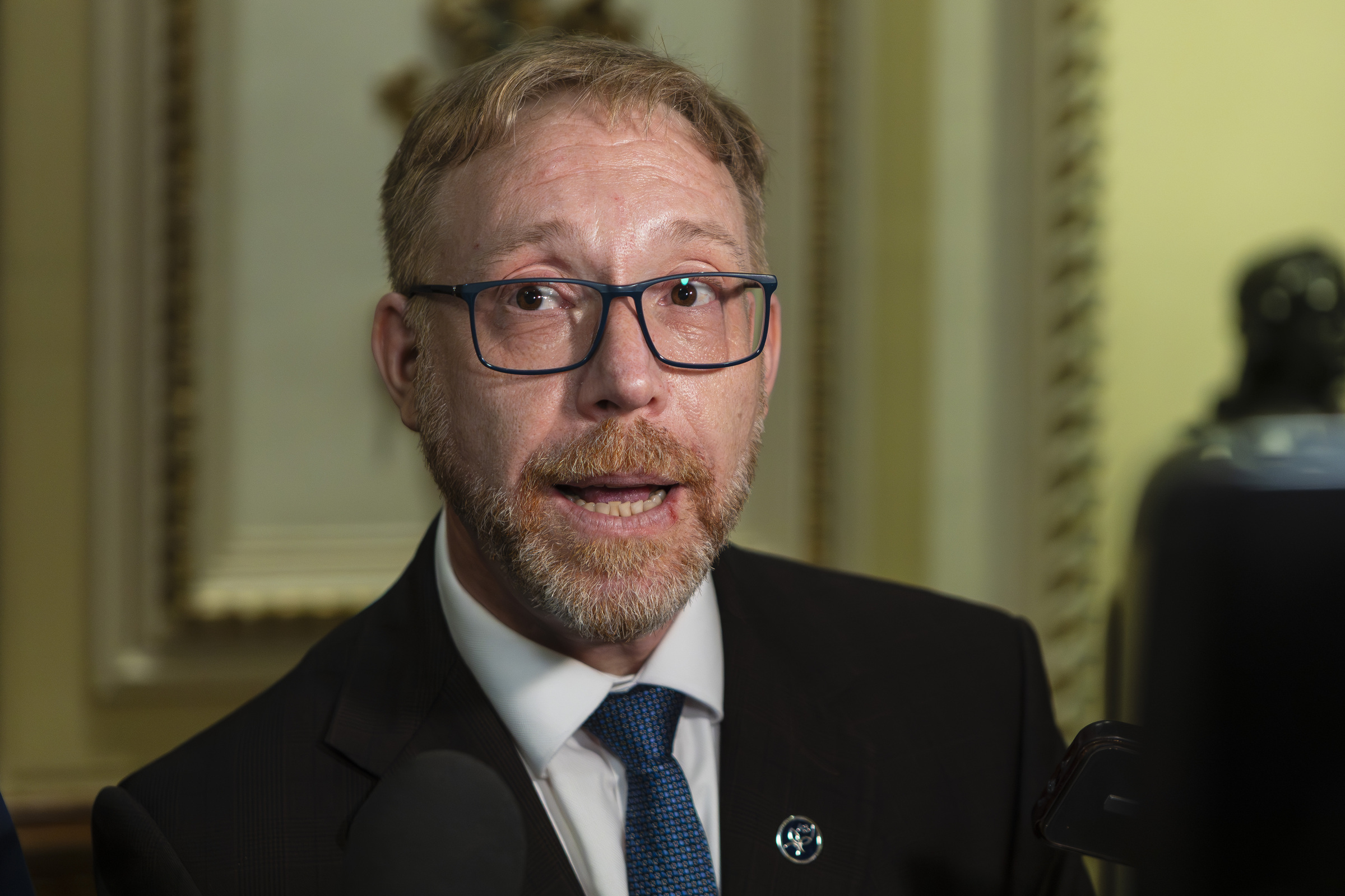 Youri Chassin speaks in a closeup photo.