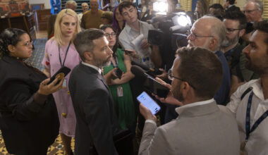 Gabriel Nadeau-Dubois in a media scrum as seen from slightly above.