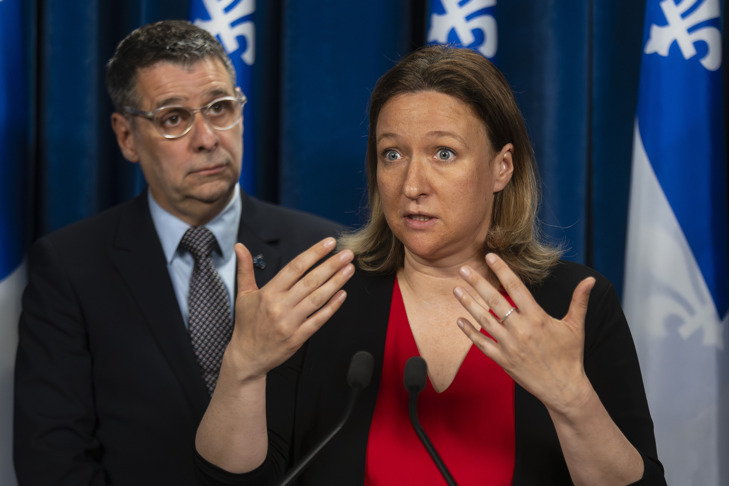 Quebec Conservative MNA Maïté Blanchette Vézina speaks to the media during a press conference with Eric Duhaime behind her.