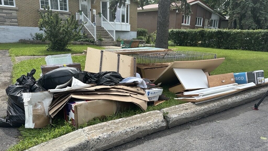 Cleanup continues in West Island communities flooded by heavy rain