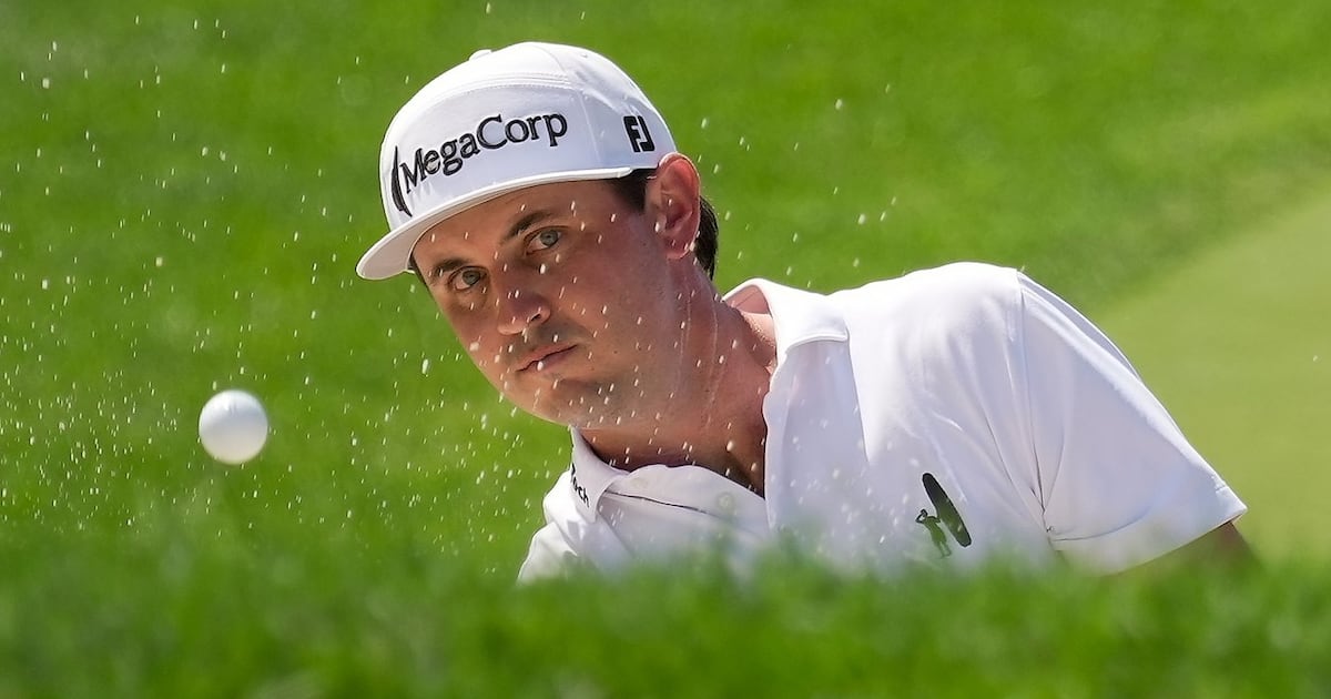 J.T. Poston handles the wind at Memorial for low round of tournament and the lead