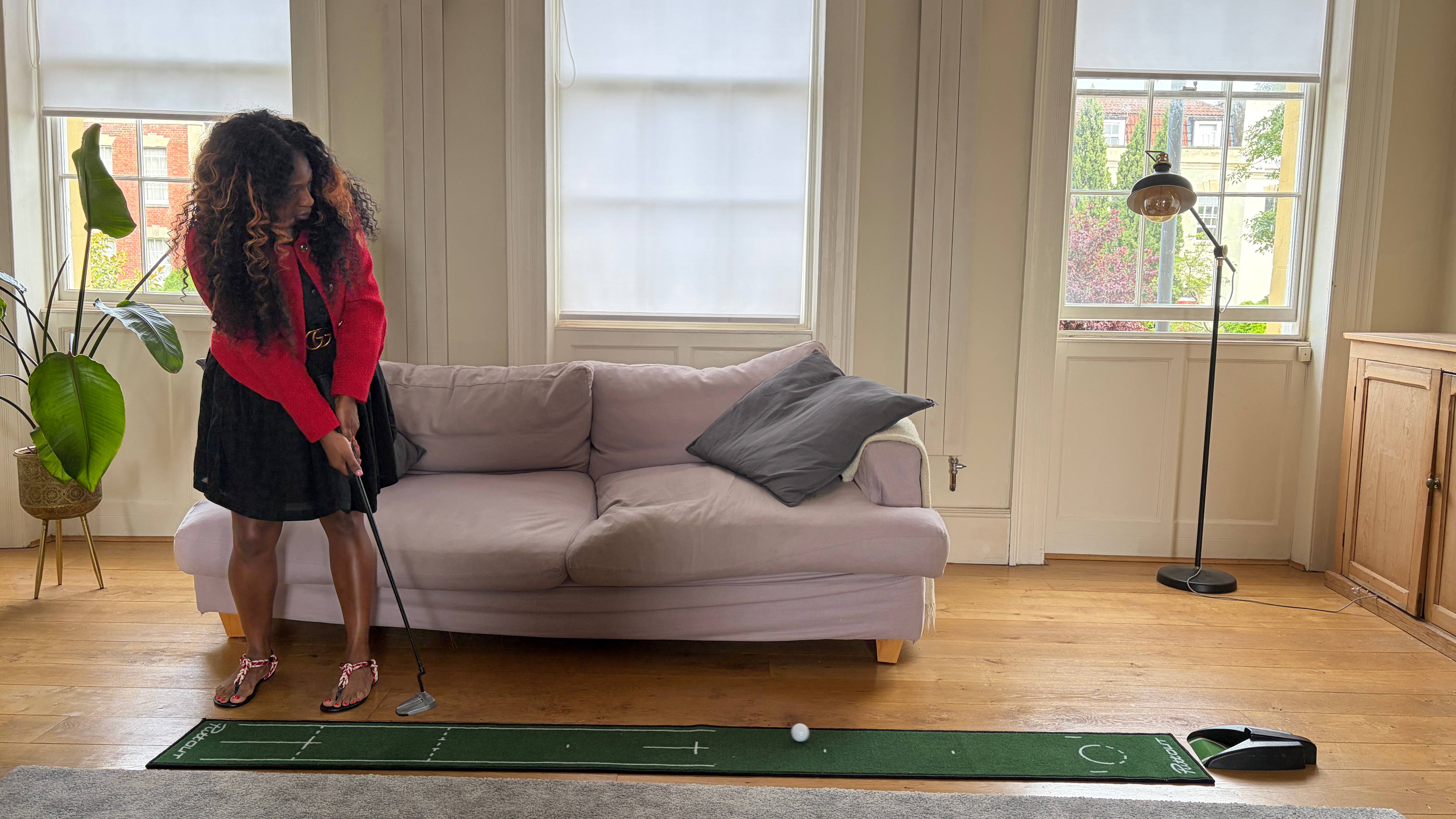 Genelle Aldred putting on a mat at home