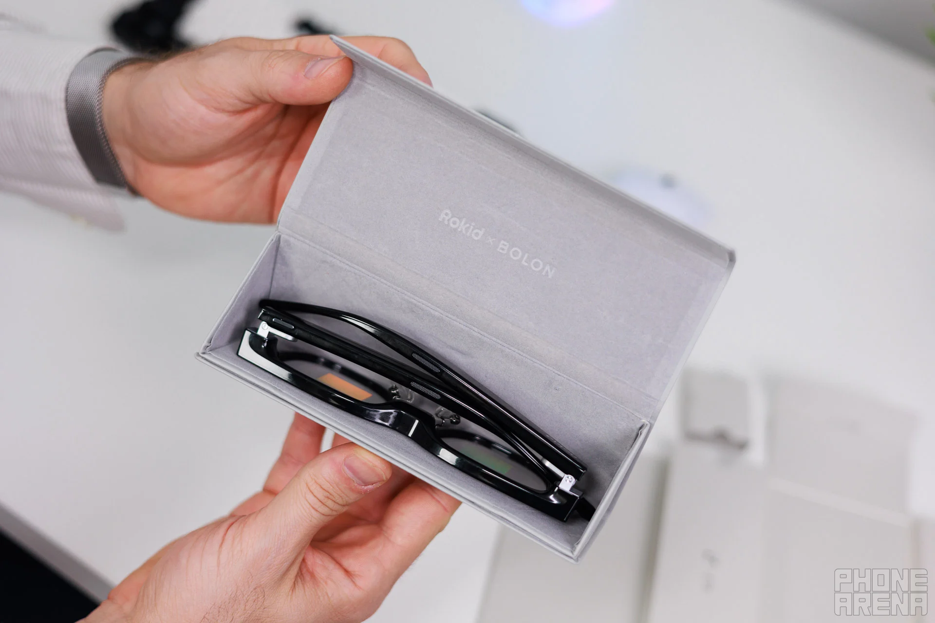 Putting them the right way in takes a bit of practice. | Image by PhoneArena - Rokid Glasses review: AI glasses with a screen