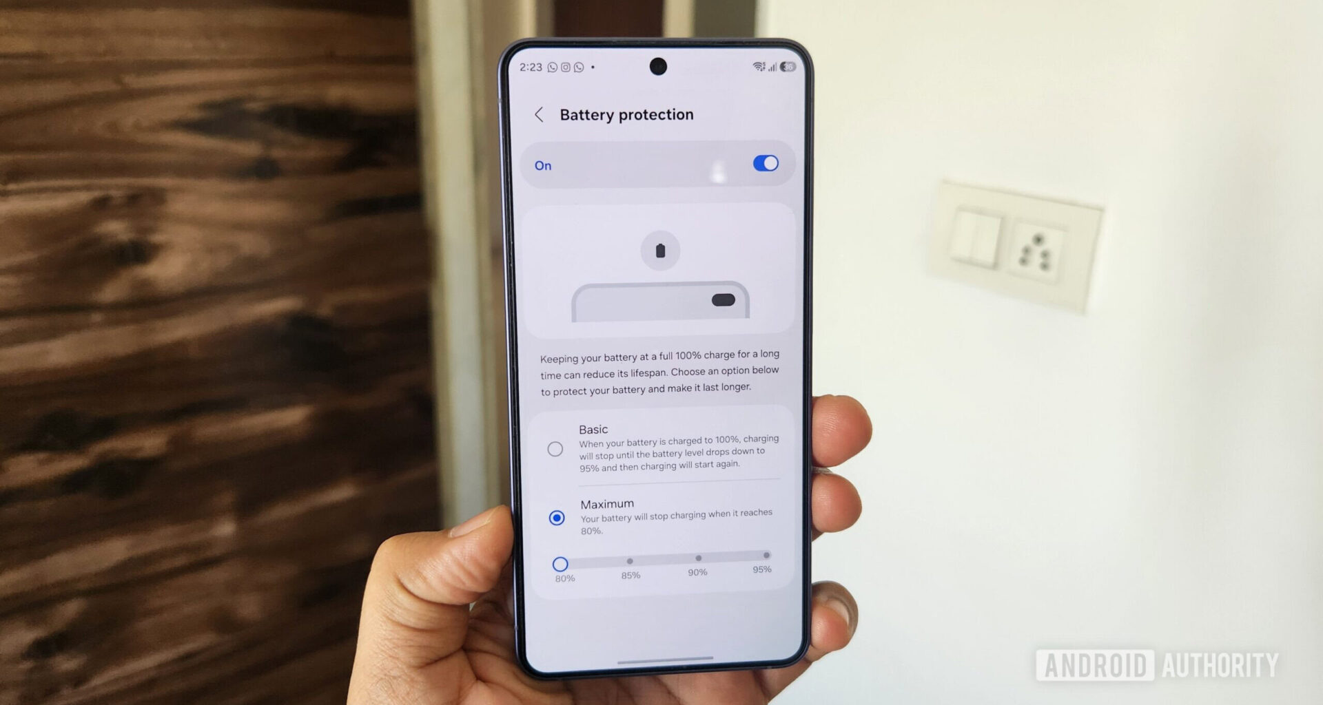 S26 in hand showing battery protection menu