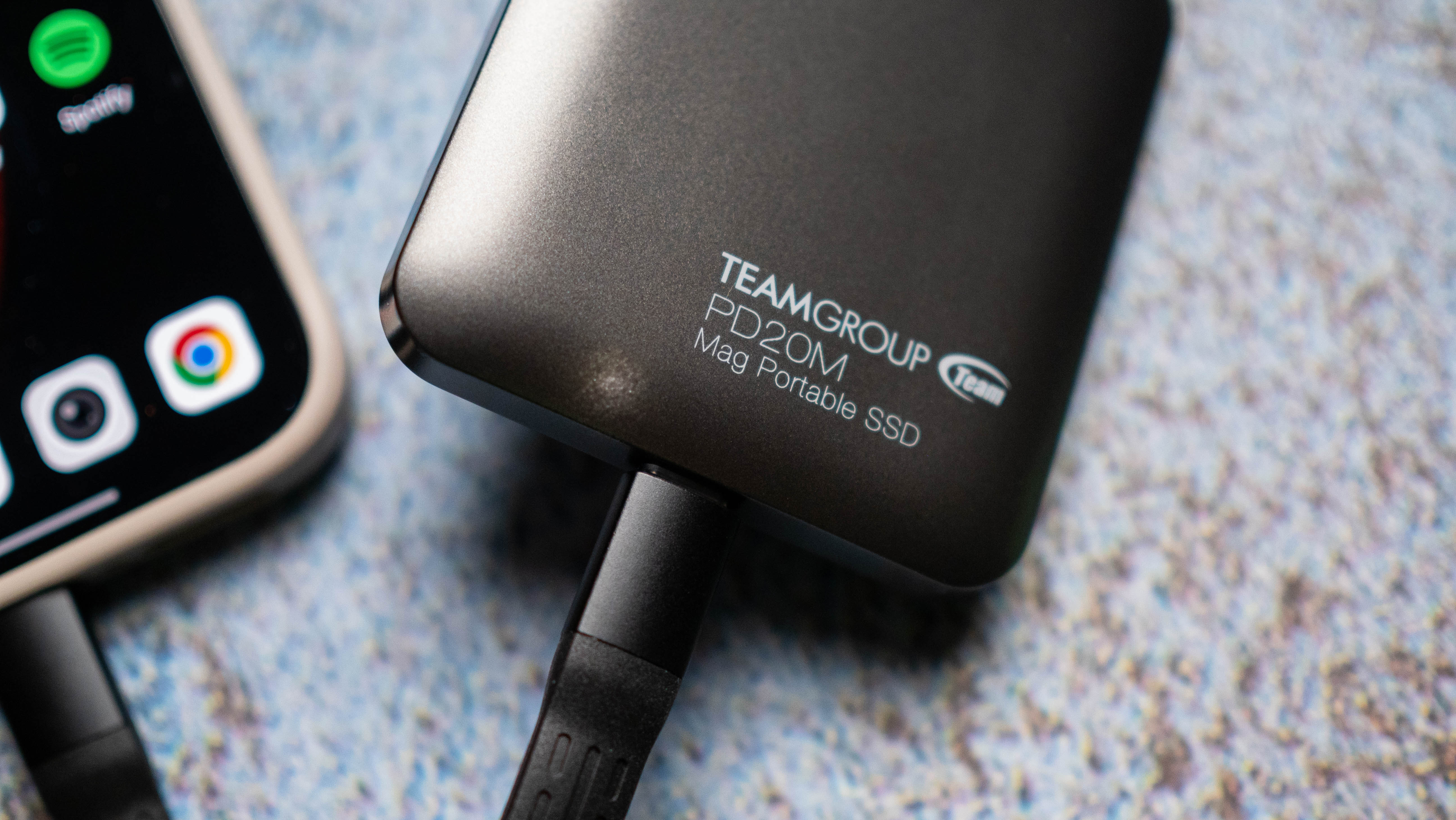 TeamGroup PD20M MagSafe SSD design photos against a craft sheet