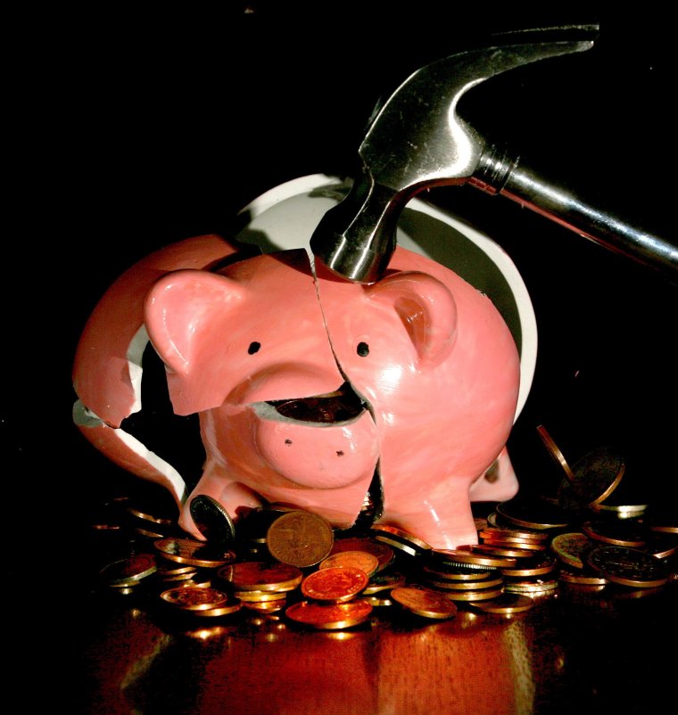 Undated file photo of a traditional piggy bank being smashed open. Cost-of-living concerns could drive some pension savers into scammers' clutches, research from the City regulator suggests. A quarter (25 percent) of people said they would consider withdrawing their pension savings earlier than planned to cover living costs, potentially making them vulnerable to criminals. Issue date: Thursday October 6, 2022. PA Photo. The Financial Conduct Authority (FCA) is warning that scammers are using "misdirection" tactics to con victims, including promising them a better lifestyle in their later years. See PA story MONEY Scams. Photo credit should read: Anthony Devlin/PA Wire