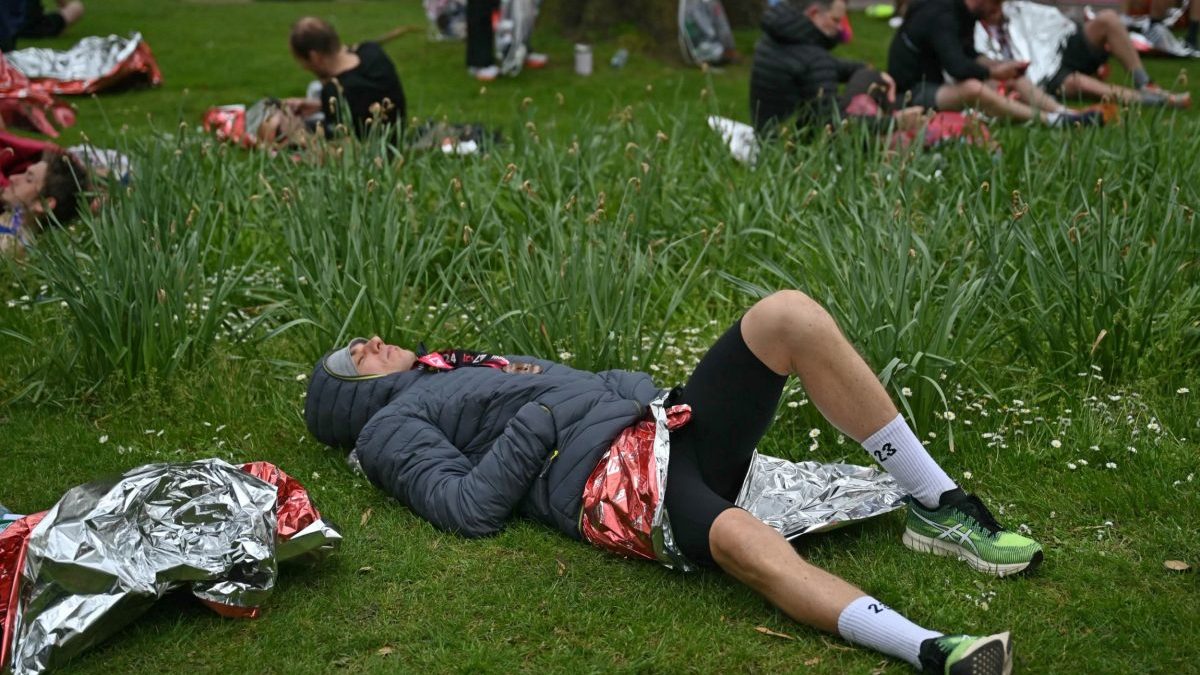 Runners recover after completing the 2024 London Marathon