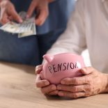 This is a photo of a woman clutching a pink piggy bank labelled pension. See PA Feature FINANCE Pension Pots. WARNING: This picture must only be used to accompany PA Feature FINANCE Pension Pots. PA Photo. Photo credit should read: Alamy/PA NOTE TO EDITORS: This picture must only be used to accompany PA Feature FINANCE Pension Pots