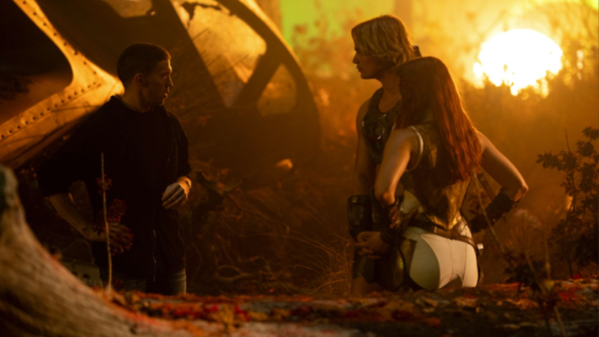 He-Man and Teela stand nearby a spacecraft.