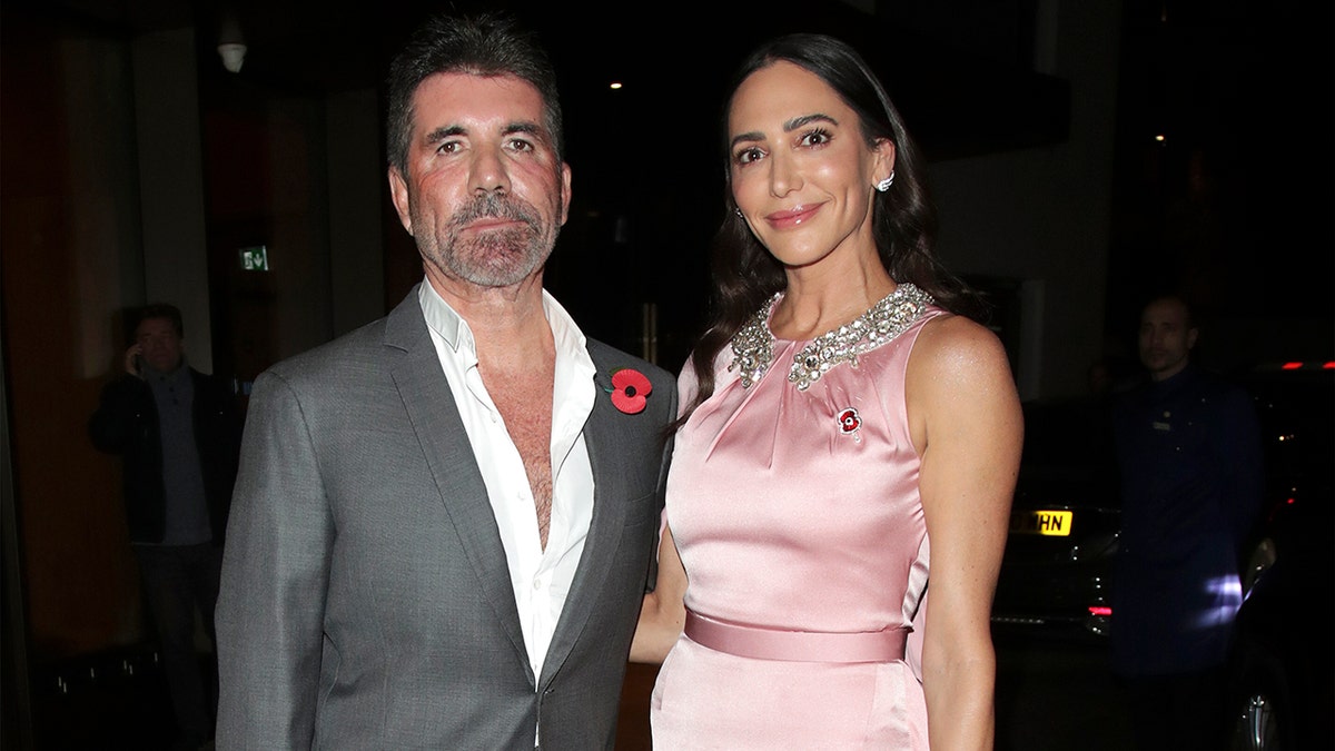 Simon Cowell and Lauren Silverman arriving at the Royal Lancaster Hotel in London