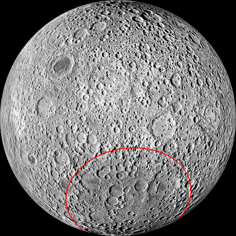 Far side of the moon. Light gray and cratered, but without large dark blotches. Red circle around a large area.