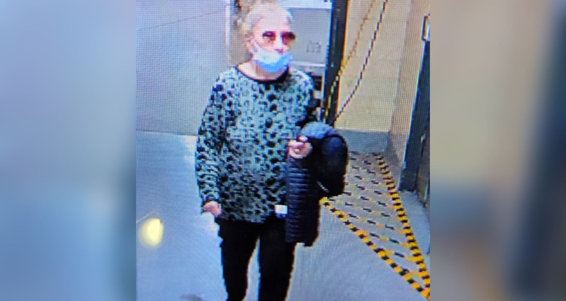 An elderly woman is seen in a still from a surveillance camera.