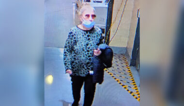 An elderly woman is seen in a still from a surveillance camera.
