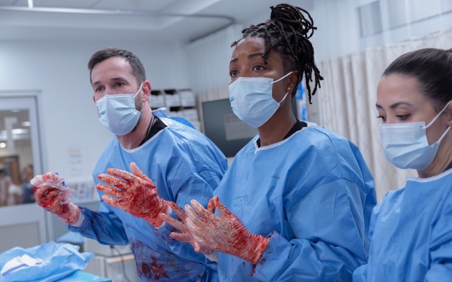 'The Pitt' Season 2 Episode 15 stars Noah Wyle as Dr. Robby and Ayesha Harris as Dr. Ellis, shown mid-operation in the Season 2 finale
