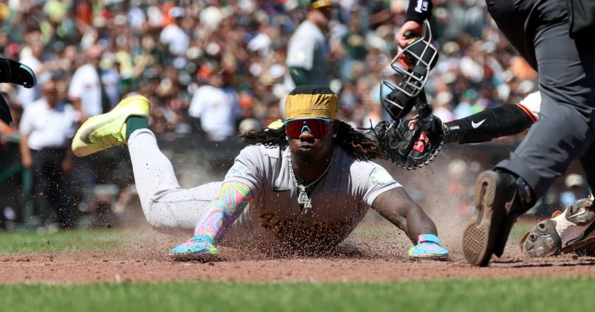 Athletics score four runs with two outs in ninth, rally to beat the Giants