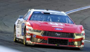 Ryan Blaney drives a Ford Mustang during NASCAR competition at Charlotte Motor Speedway.