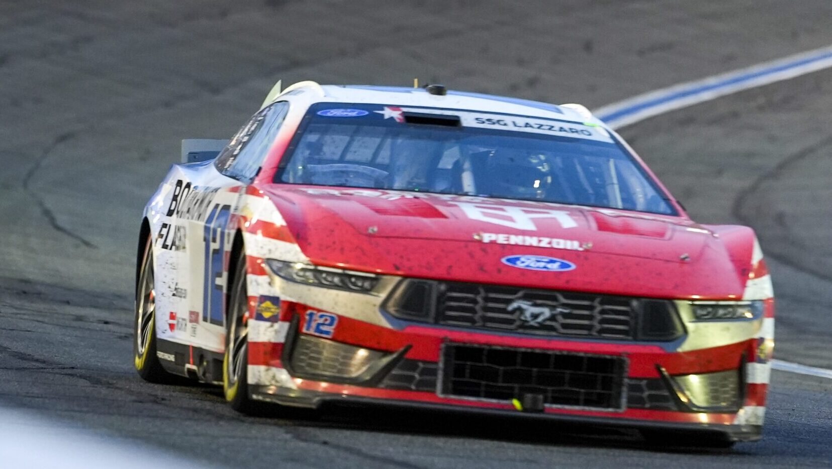 Ryan Blaney drives a Ford Mustang during NASCAR competition at Charlotte Motor Speedway.