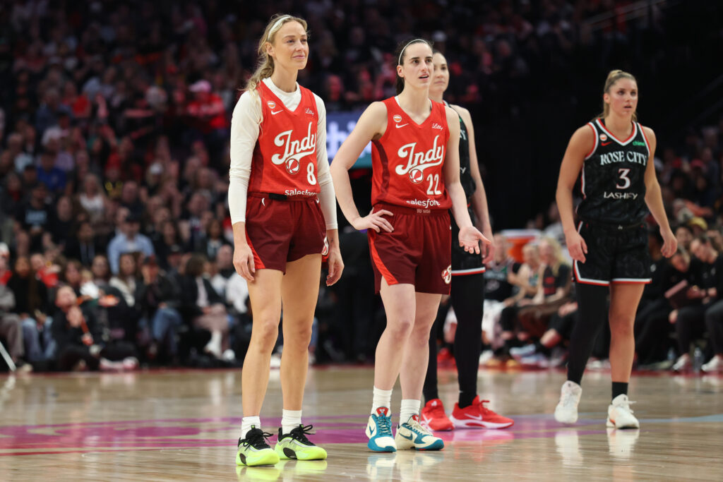 May 30, 2026; Portland, Oregon, USA; Indiana Fever guard Sophie Cunningham (8) and guard Caitlin Clark (22) stand next to each other during the second half against the Portland Fire at Moda Center. Mandatory Credit: Jaime Valdez-Imagn Images