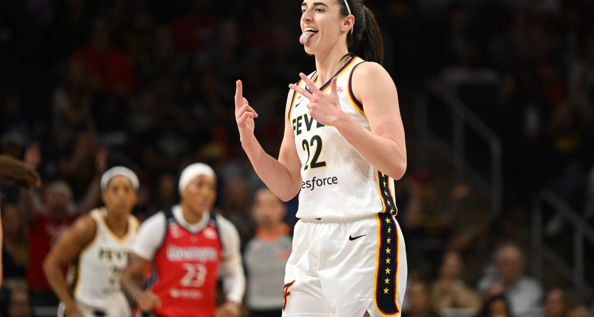Jun 8, 2026; Washington, District of Columbia, USA; Indiana Fever guard Caitlin Clark (22) reacts after making a three-point basket against the Washington Mystics during the first quarter at CareFirst Arena. Mandatory Credit: Rafael Suanes-Imagn Images