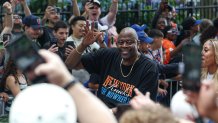 Jun 18, 2026; New York, NY, USA; Former New York Knicks player Patrick Ewing celebrates during the Knicks championship ticker tape parade up the Canyon of Heroes in downtown Manhattan. Mandatory Credit: Vincent Carchietta-Imagn Images
