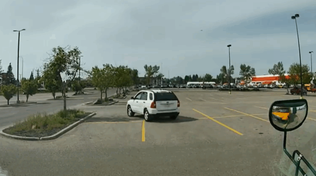 The screenshot of CCTV footage that captured a white Honda CR-V with Alberta license plate CYT-3101 reportedly involved in a catalytic theft in Calgary on Monday, June 15, 2026