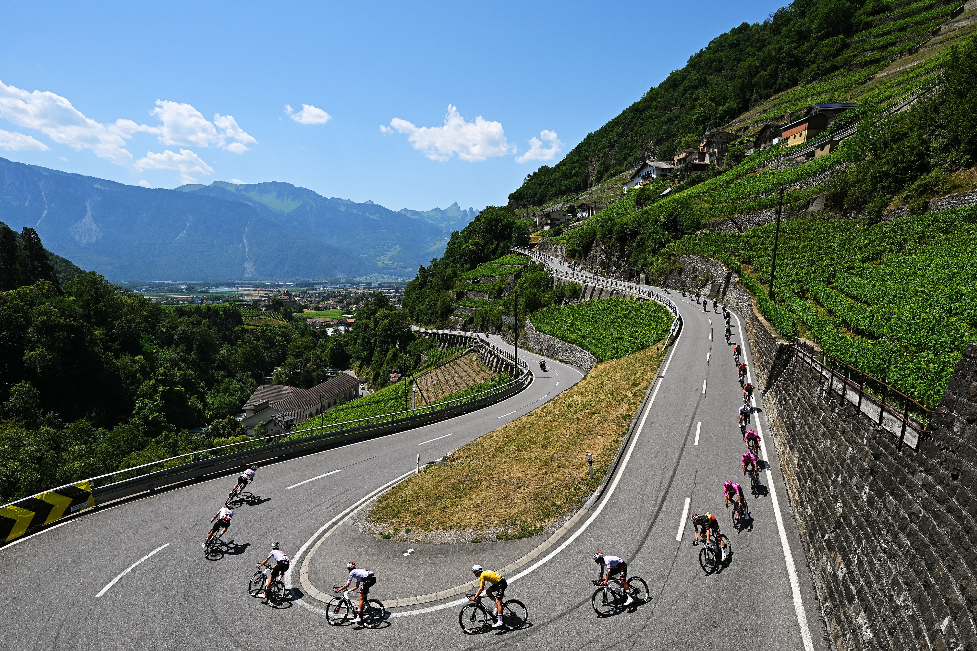 VILLARS-SUR-OLLON, SWITZERLAND - JUNE 21: Tadej Pogacar of Slovenia and UAE Team Emirates - XRG - Yellow Leader Jersey and a general view of the chase group climbing down the Col de la Croix (1776m) close to Aigle Village during the 89th Tour de Suisse 2026, Stage 5 a 150.7km stage from Villars-sur-Ollon to Villars-sur-Ollon 1249m / #UCIWT / on June 21, 2026 in Villars-sur-Ollon, Switzerland. (Photo by Tim de Waele/Getty Images)