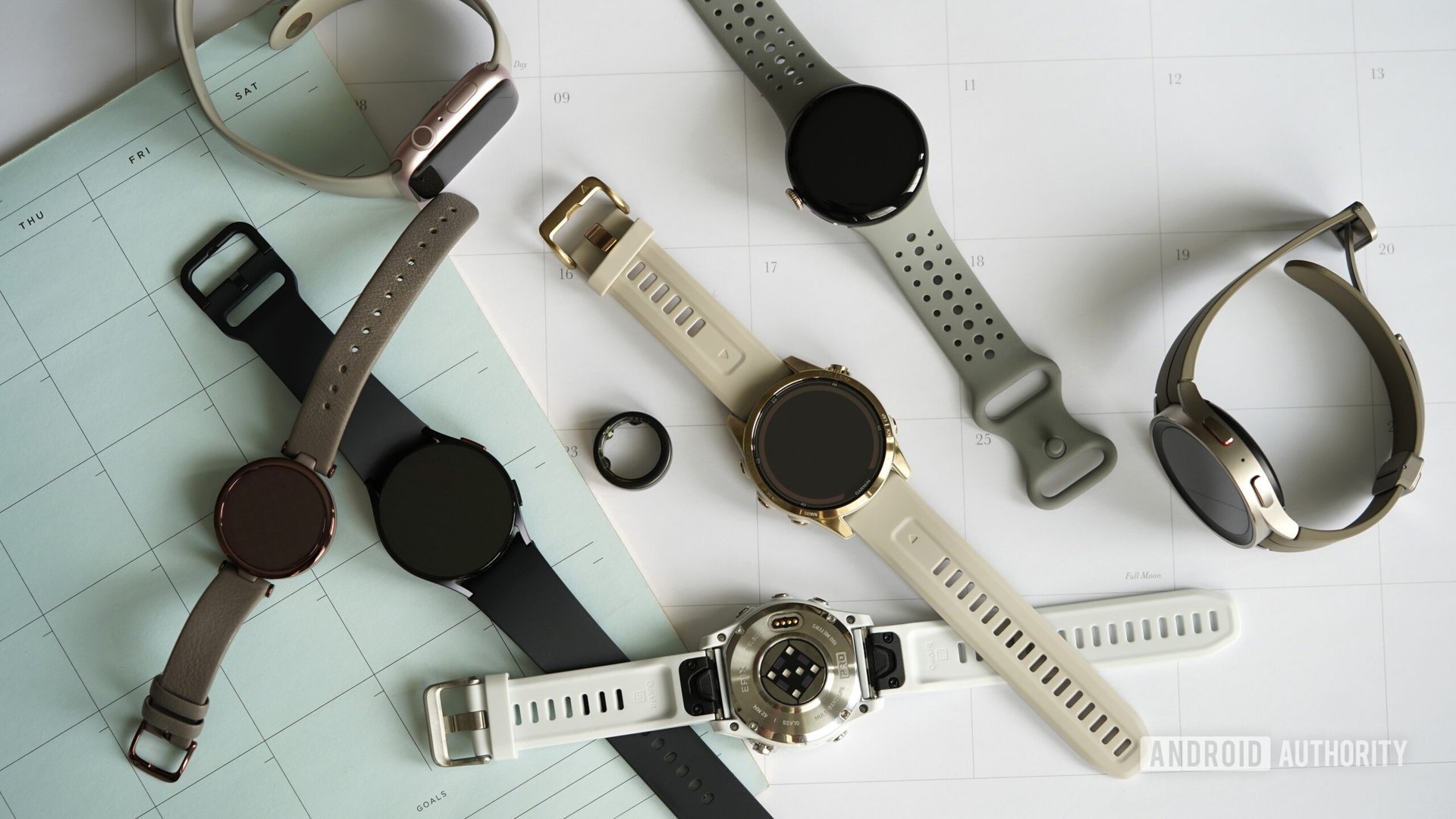 Upcoming Wearables 2024 A variety of wearables rest on a collection of 2024 calendars.