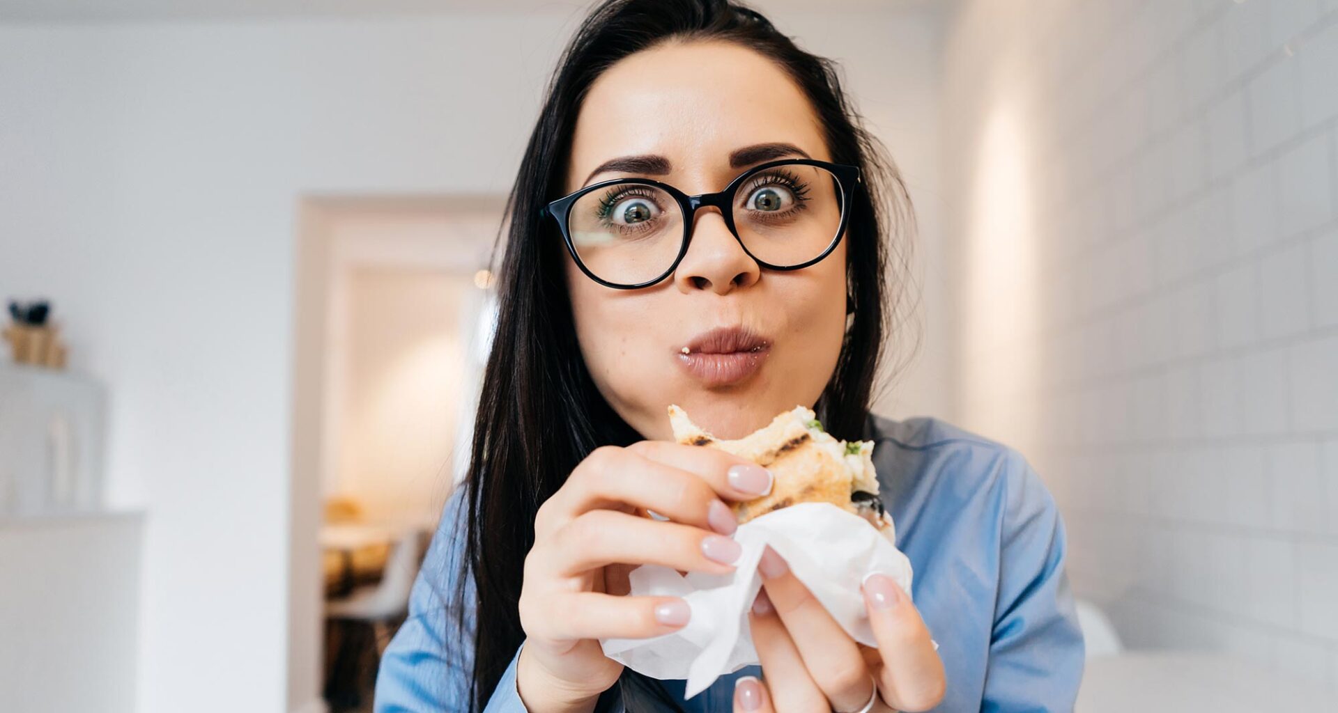 Woman Eating Sandwich