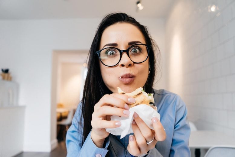 Woman Eating Sandwich