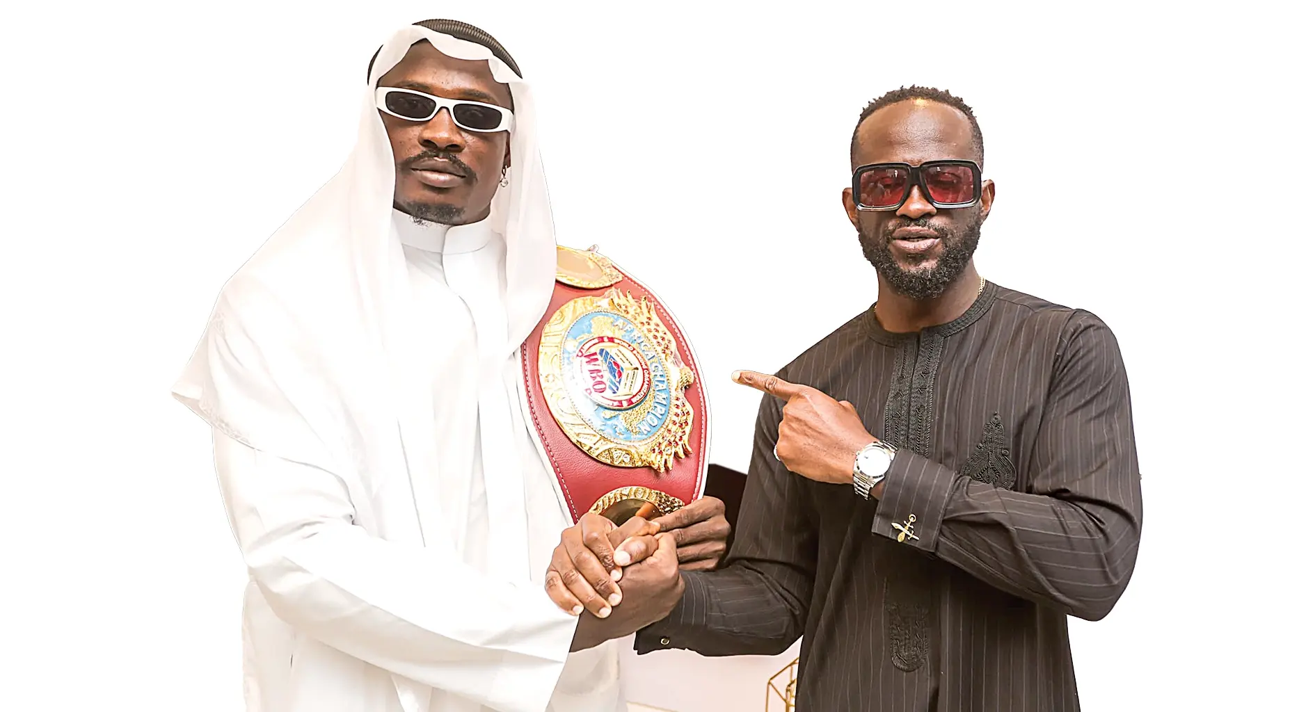 World Boxing Organisation (WBO) Cruiserweight Africa Champion, Appah Godday (left) and Founder, N Effect Mode Limited, Osa Bazu, during the belt presentation in Lagos at the weekend.