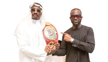 World Boxing Organisation (WBO) Cruiserweight Africa Champion, Appah Godday (left) and Founder, N Effect Mode Limited, Osa Bazu, during the belt presentation in Lagos at the weekend.