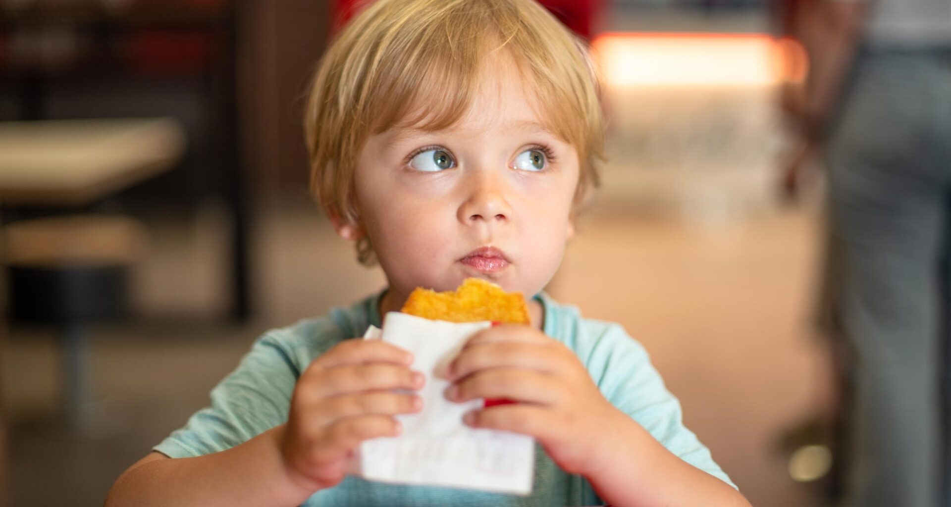 Young Child Eating Fast Food