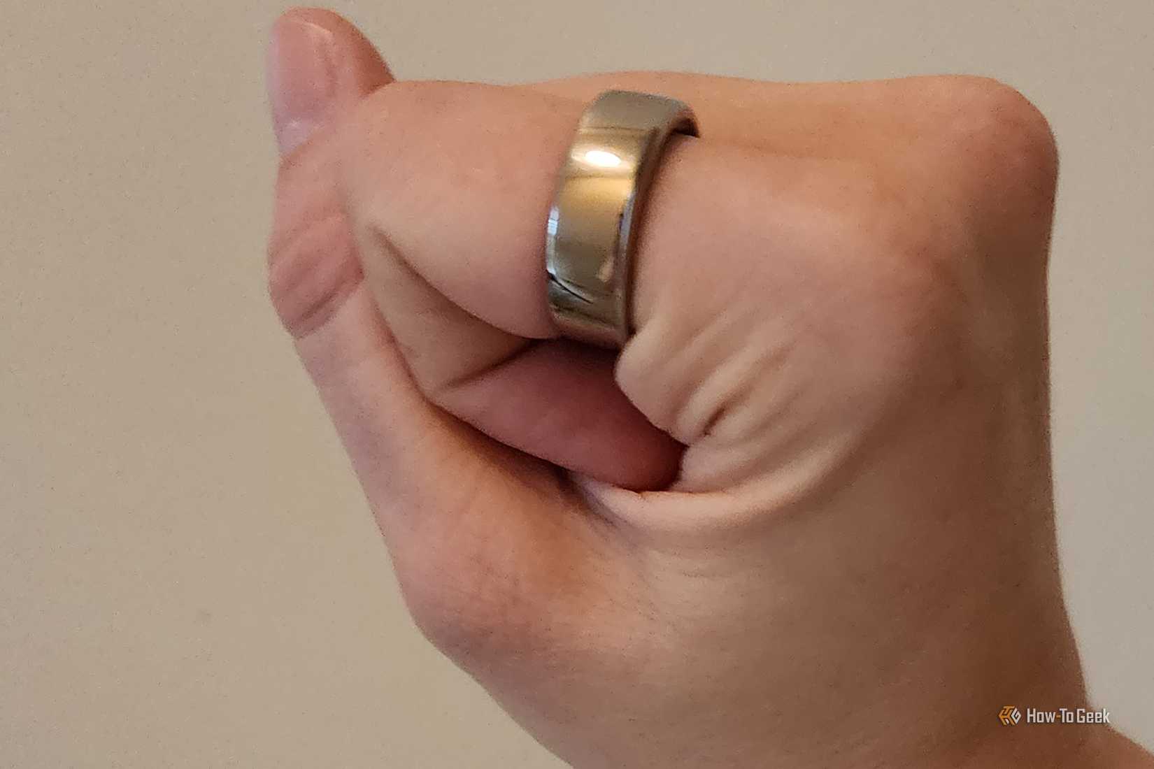 A person's hand wearing the 3rd Generation Oura Ring.