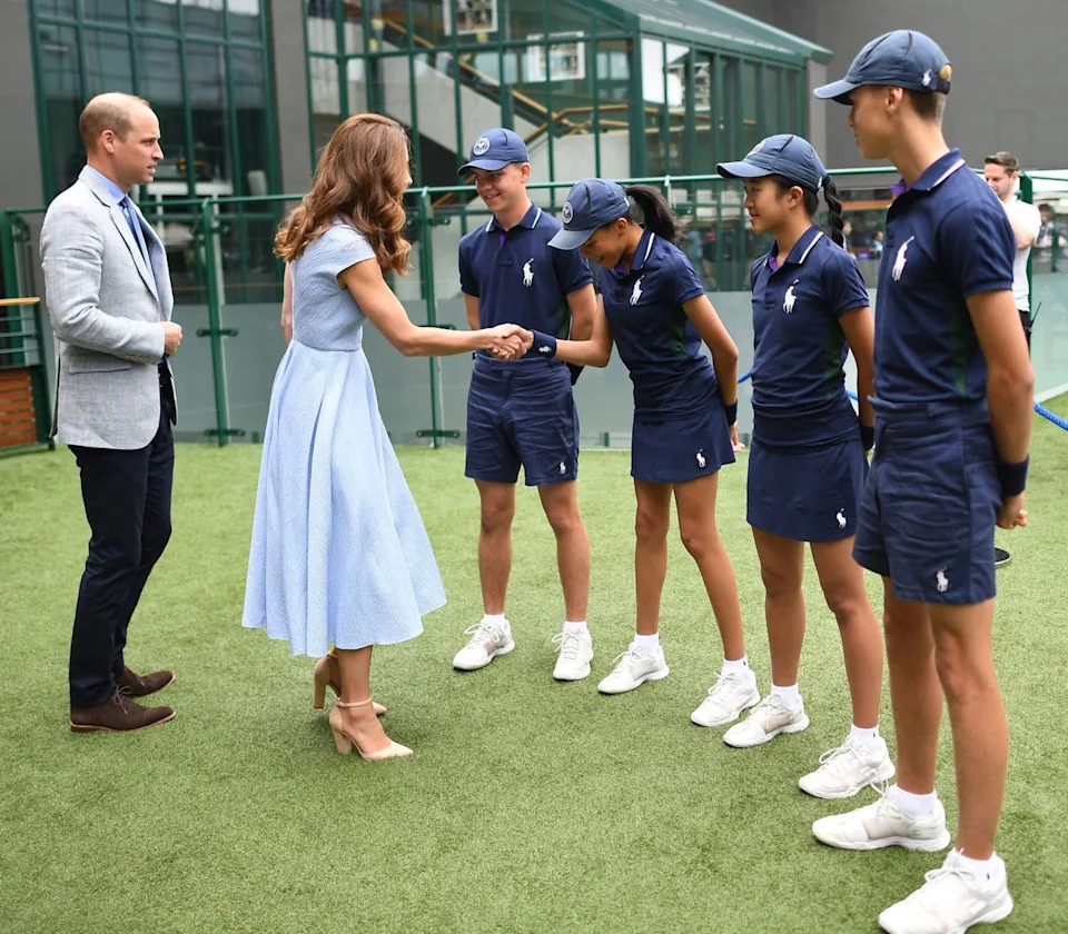 The Duke and Duchess of Cambridge meet ballboys and ballgirls, who have new rules this year (PA)