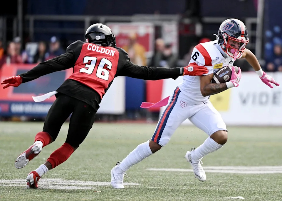 Alouettes receiver Tyson Philpot gets by former Redblacks defensive back CJ Coldon in Montreal, Oct. 13, 2025. THE CANADIAN PRESS/Graham Hughes