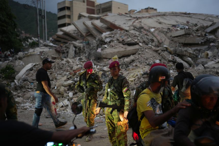 Soldiers guard an area damaged by the earthquakes in La Guaira, Venezuela, on Saturday, June 27, 2026.